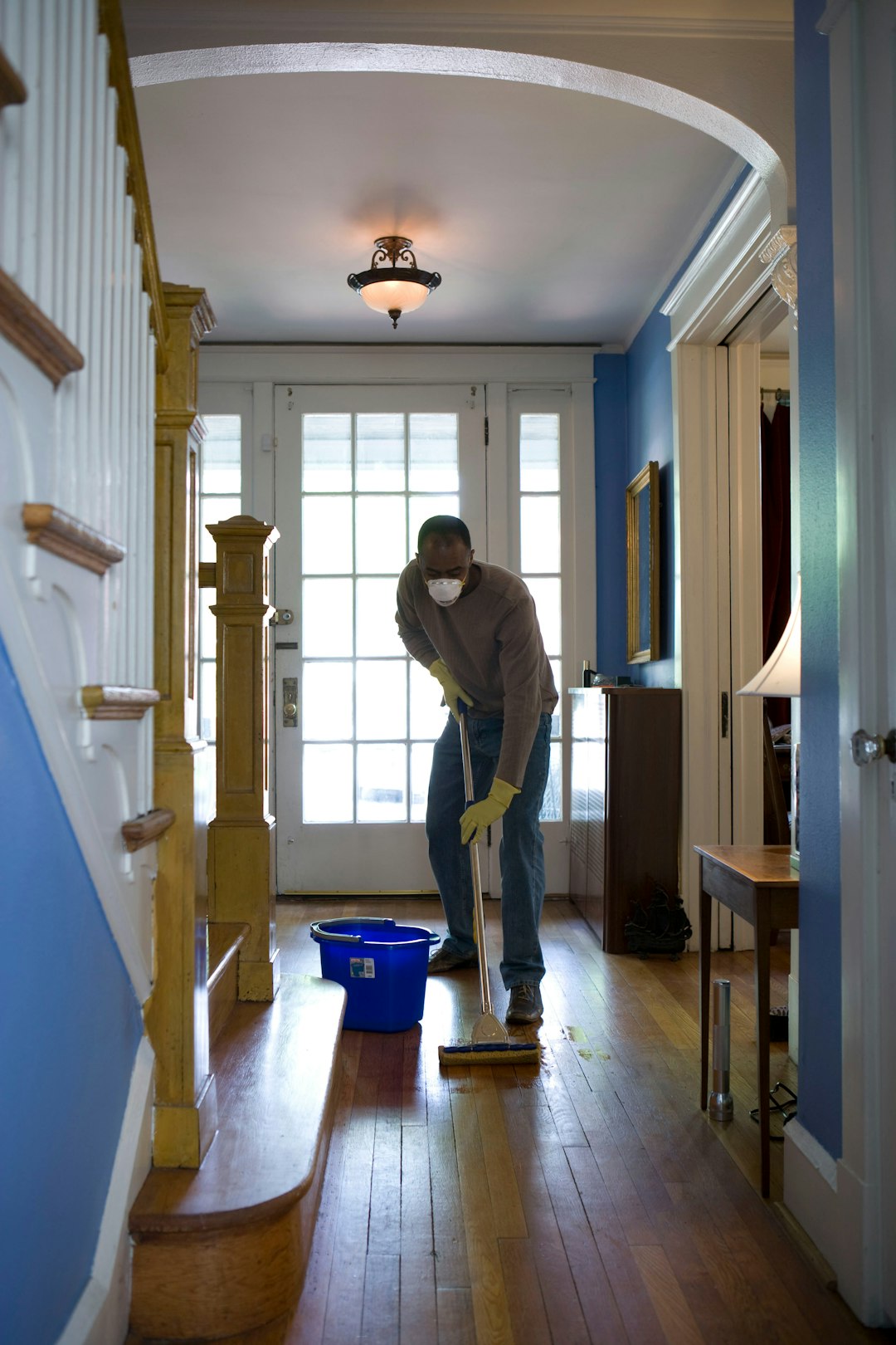 why-choose-us-03 This African-American man was in the process of damp-mopping his home’s entrance way. In this way airborne particulates including dust and pollen, could be removed from the inside of his home, thereby, reducing the detrimental effects these substances have upon the respiratory system of his family members. These irritants can sometimes result in sinus infections, and asthma.
